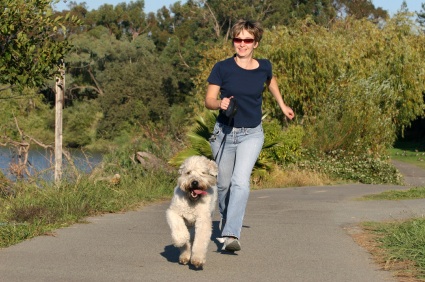 woman running with her dog