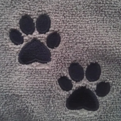 Embroidered paw prints on DryPet Towel