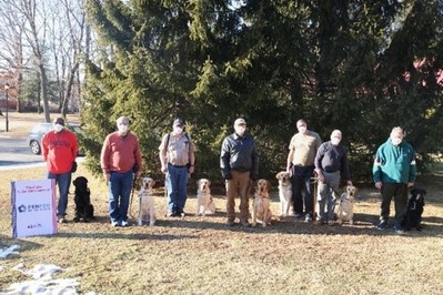 Group of veterans and first responders with disabilities and their service dogs