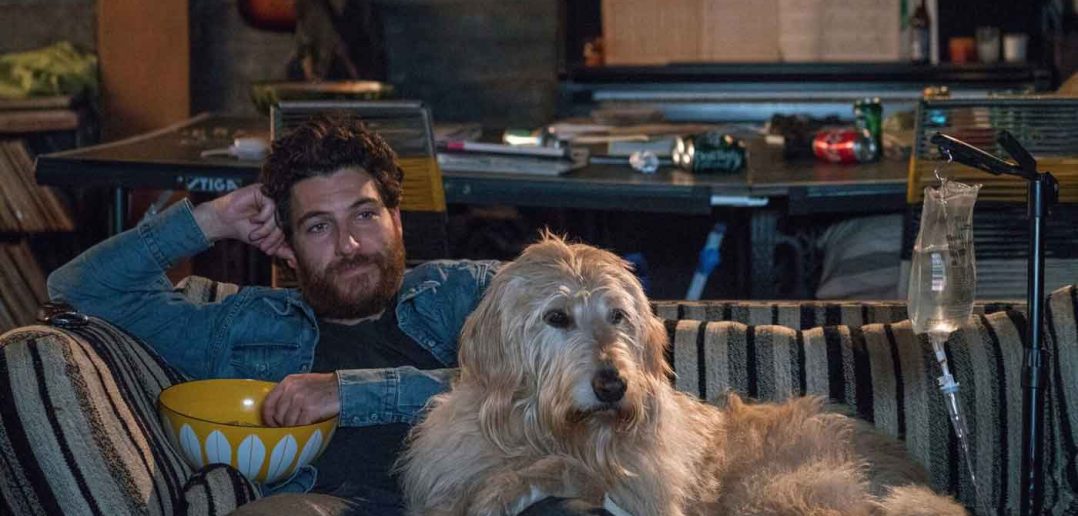 Adam Pally as Dax with Charlie the Dog in DOG DAYS movie