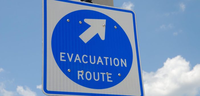 closeup of an evacuation road sign