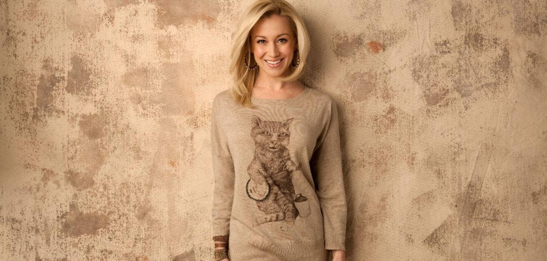 Promo photo of Kelly Pickler wearing the kitty crooner sweater
