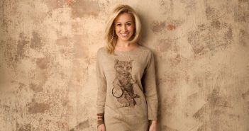 Promo photo of Kelly Pickler wearing the kitty crooner sweater