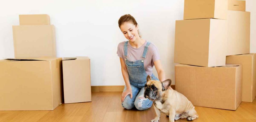 woman moving into n apartment with her dog