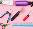pet grooming tools including a clippers, spray bottle, combs, brushes, and nail clippers