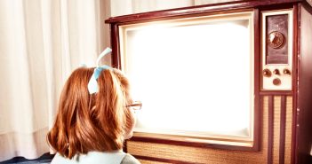 young girl watching tv in the 70s