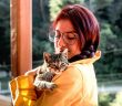 photo of a woman hugging her pet cat